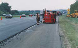 Cracksealing the side of a major Boston Highway.